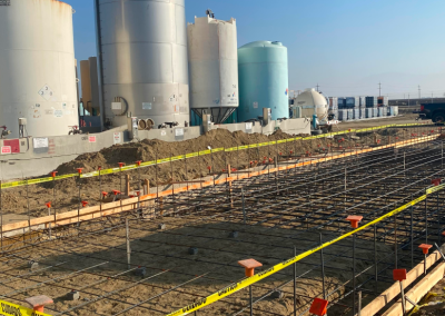 Industrial tank facility under construction — concrete foundation and rebar Kern County CA