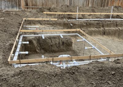 New construction plumbing rough-in and foundation forming — ground-up build Kern County
