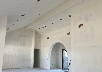 Open great room with vaulted ceiling framing — new construction Bakersfield CA