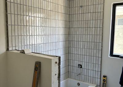 Custom built-in shelving and entertainment wall — luxury living room remodel Bakersfield CA