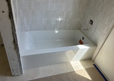 Herringbone tile shower under construction — bathroom remodel Bakersfield CA