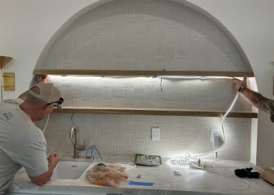 Custom arched kitchen niche installation with crew — residential remodel Bakersfield