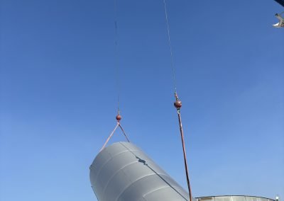 Crane setting large industrial tank — industrial construction Kern County CA