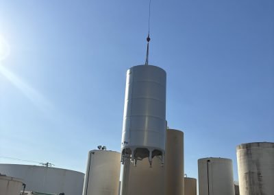 Industrial tank installation with crane — commercial contractor Bakersfield CA