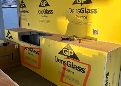 Outdoor kitchen DensGlass framing in progress — exterior construction Kern County