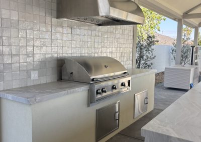 Custom outdoor kitchen detail with stone countertop — residential construction Bakersfield CA