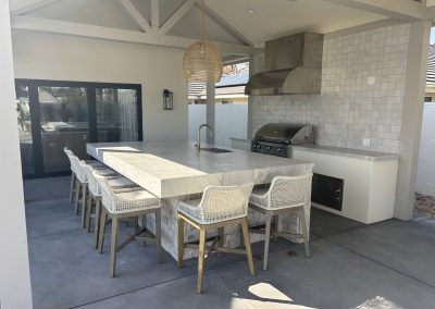 Outdoor kitchen stone island with grill — custom residential construction Bakersfield