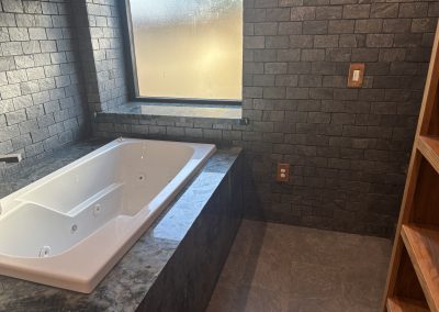 Freestanding jetted tub in luxury bathroom — home remodel Kern County