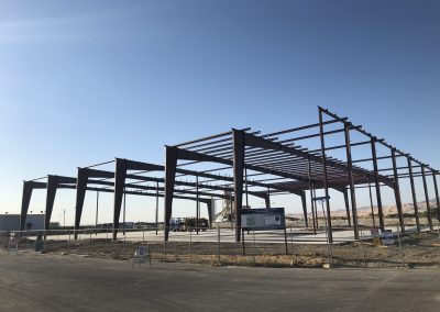 Steel frame skeleton of commercial building under construction — Bakersfield CA general contractor
